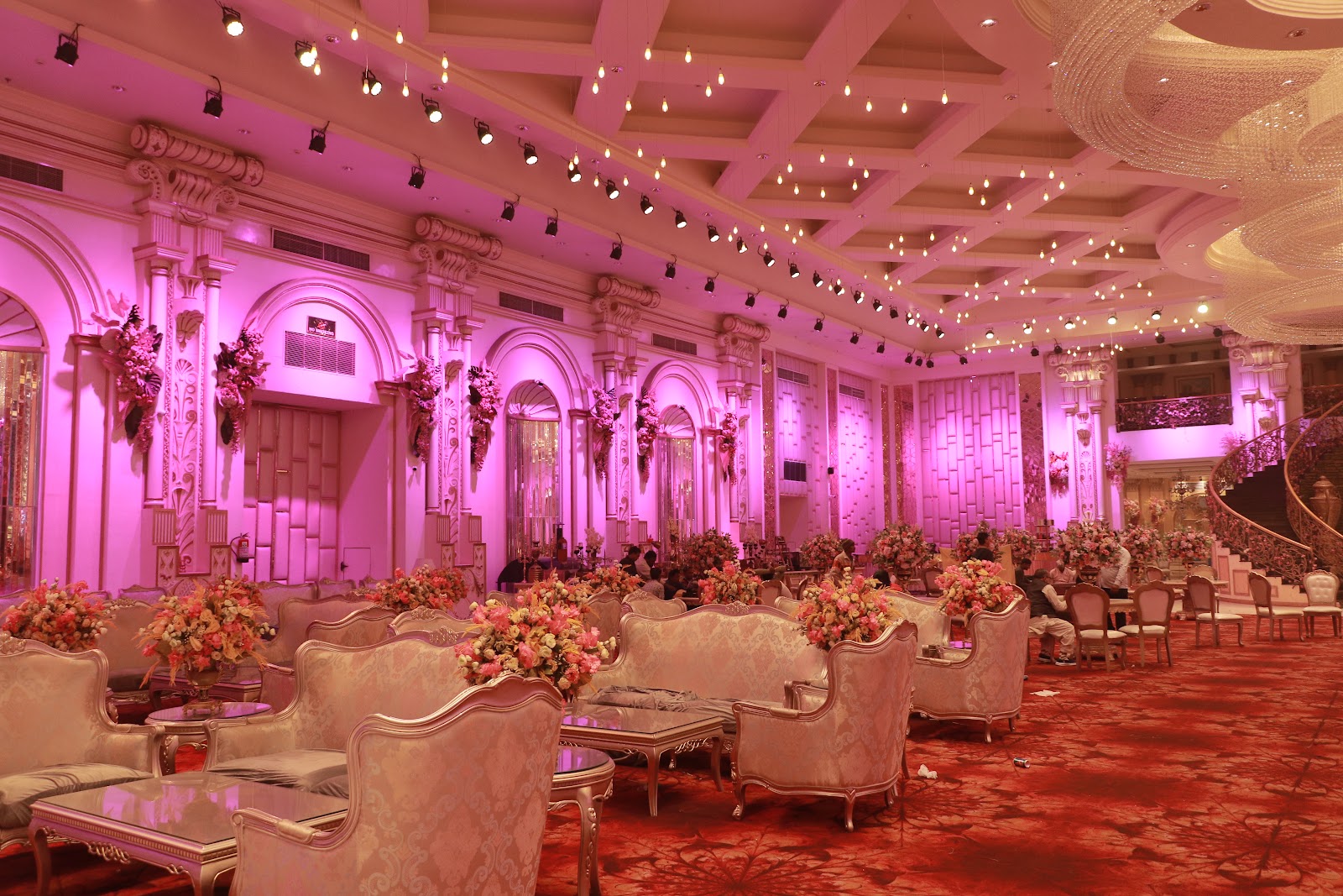 Interior of a banquet hall with neatly aligned chairs arranged for an event