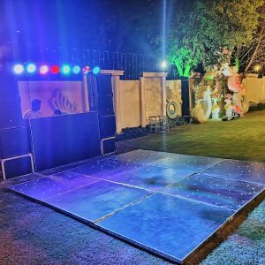 A lively DJ performing at the wedding reception, setting the perfect mood for celebration and dance. DJ Performing at Wedding Reception
